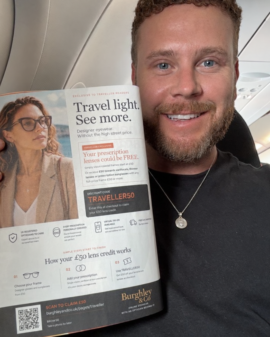 Scott Phippen holding the Burghley & Co advert in easyJet Traveller onboard an aircraft
